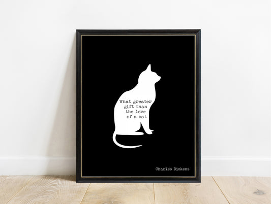 Charles Dickens love of a cat quote with a cat silhouette print in a black frame, black background