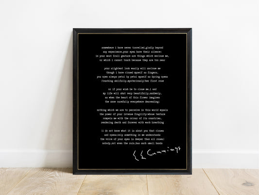 EE Cummings Somewhere I Have Never Travelled poem print in a black frame, black background