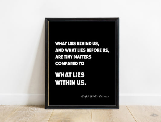 Ralph Waldo Emerson what lies within us quote print in a black frame, black background