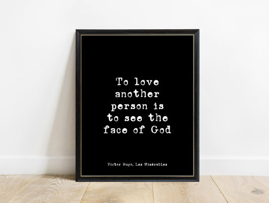Victor Hugo to love another person is to see the face of God typewriter quote print in a black frame, black background