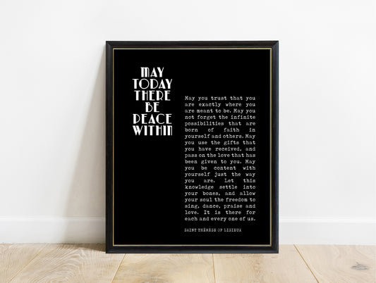 Saint Thérèse of Lisieux may today there be peace within magazine style quote print in a black frame, black background