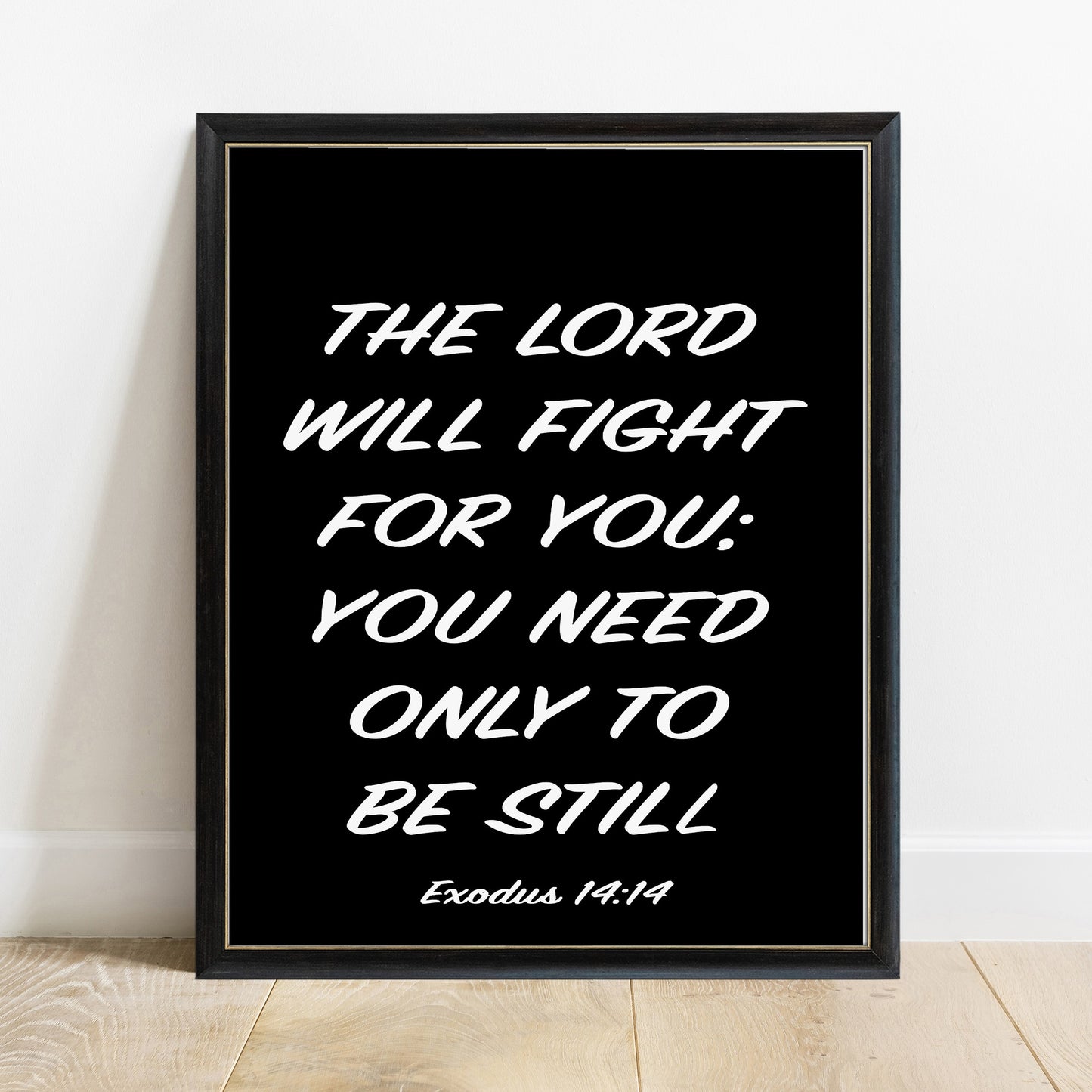 Exodus 14:14 the Lord will fight for you scripture print in a black frame, black background