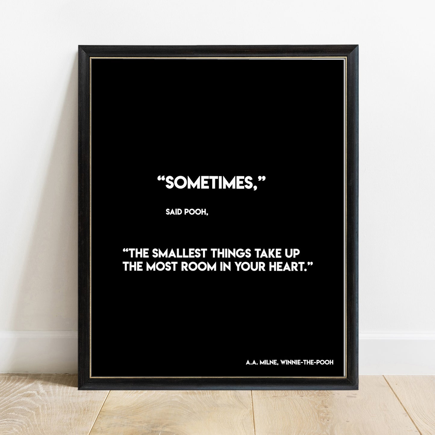 Winnie the Pooh smallest things quote print in a black frame, black background