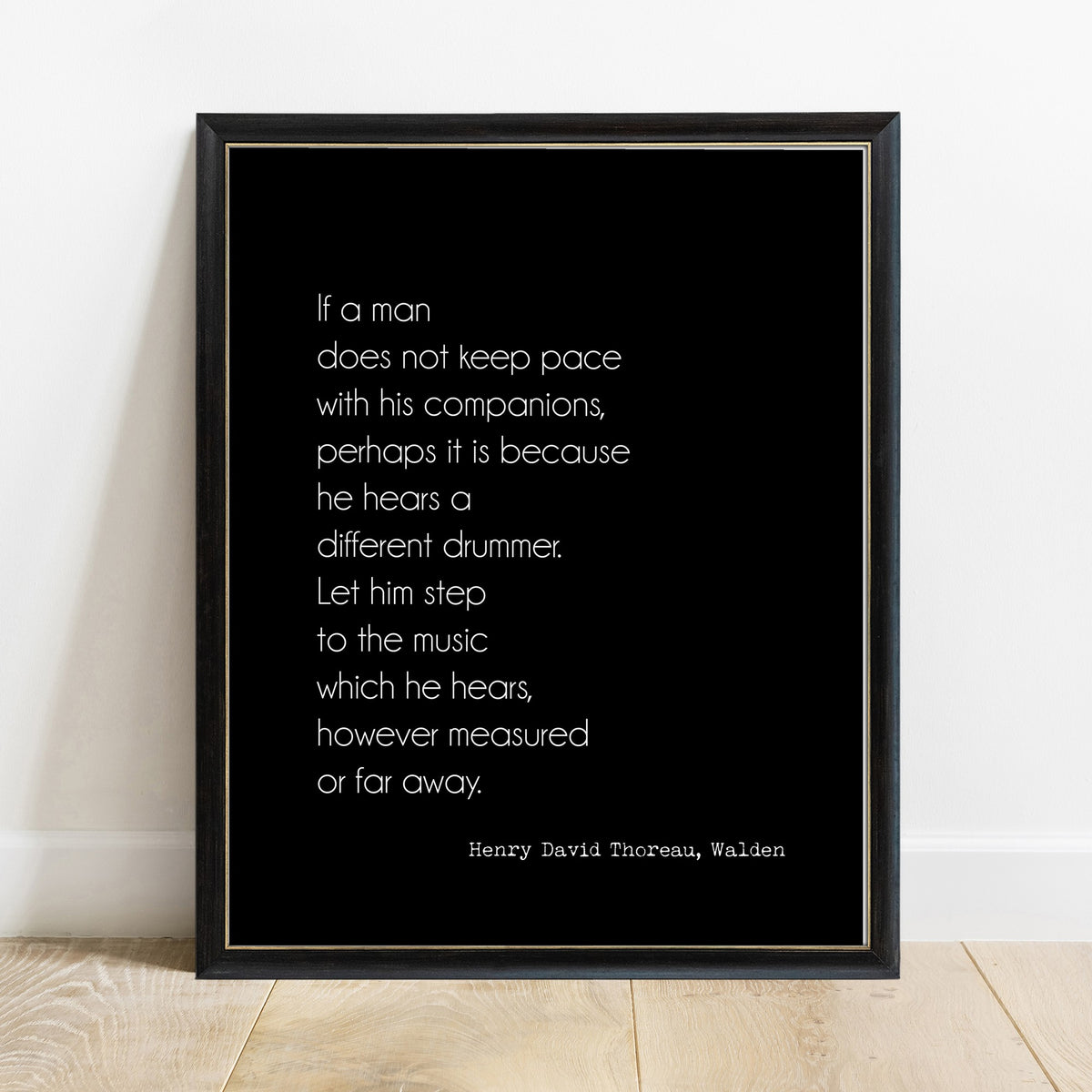 Thoreau different drummer quote print in a black frame, black background