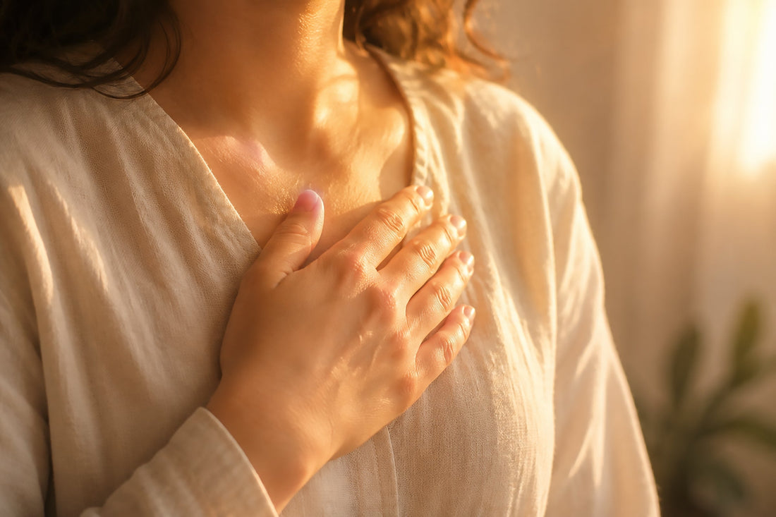 A woman holding her hand over her heart