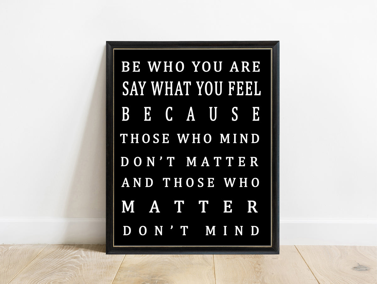 Be who you are and say what you feel bold typography print in a black frame, black background