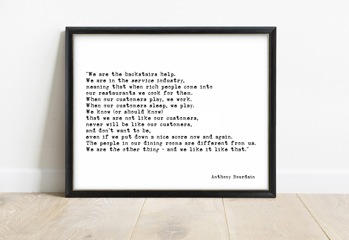 Anthony Bourdain we are the backstairs help quote print in a black frame, white background