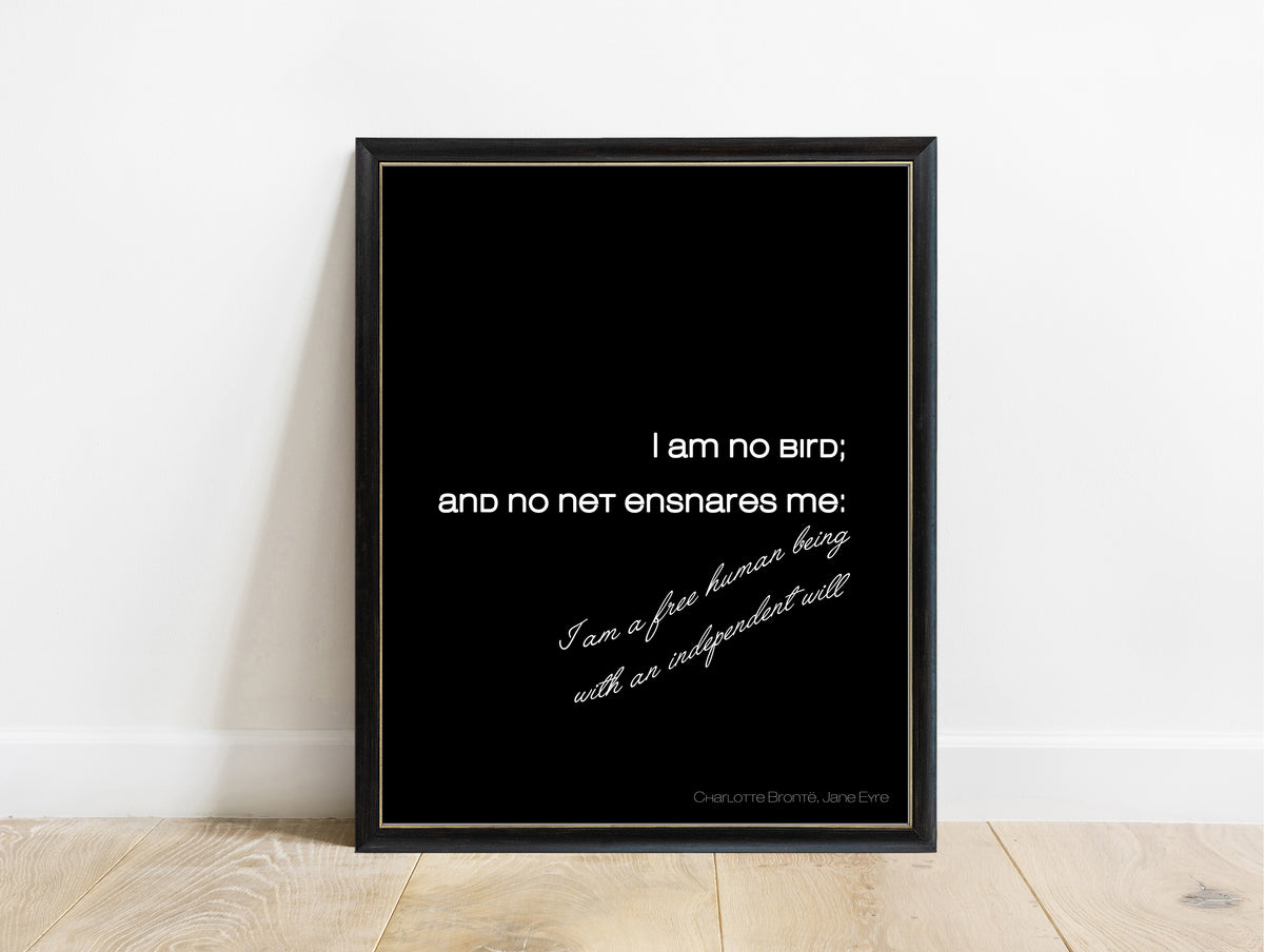 Charlotte Brontë I am no bird script quote print in a black frame, black background