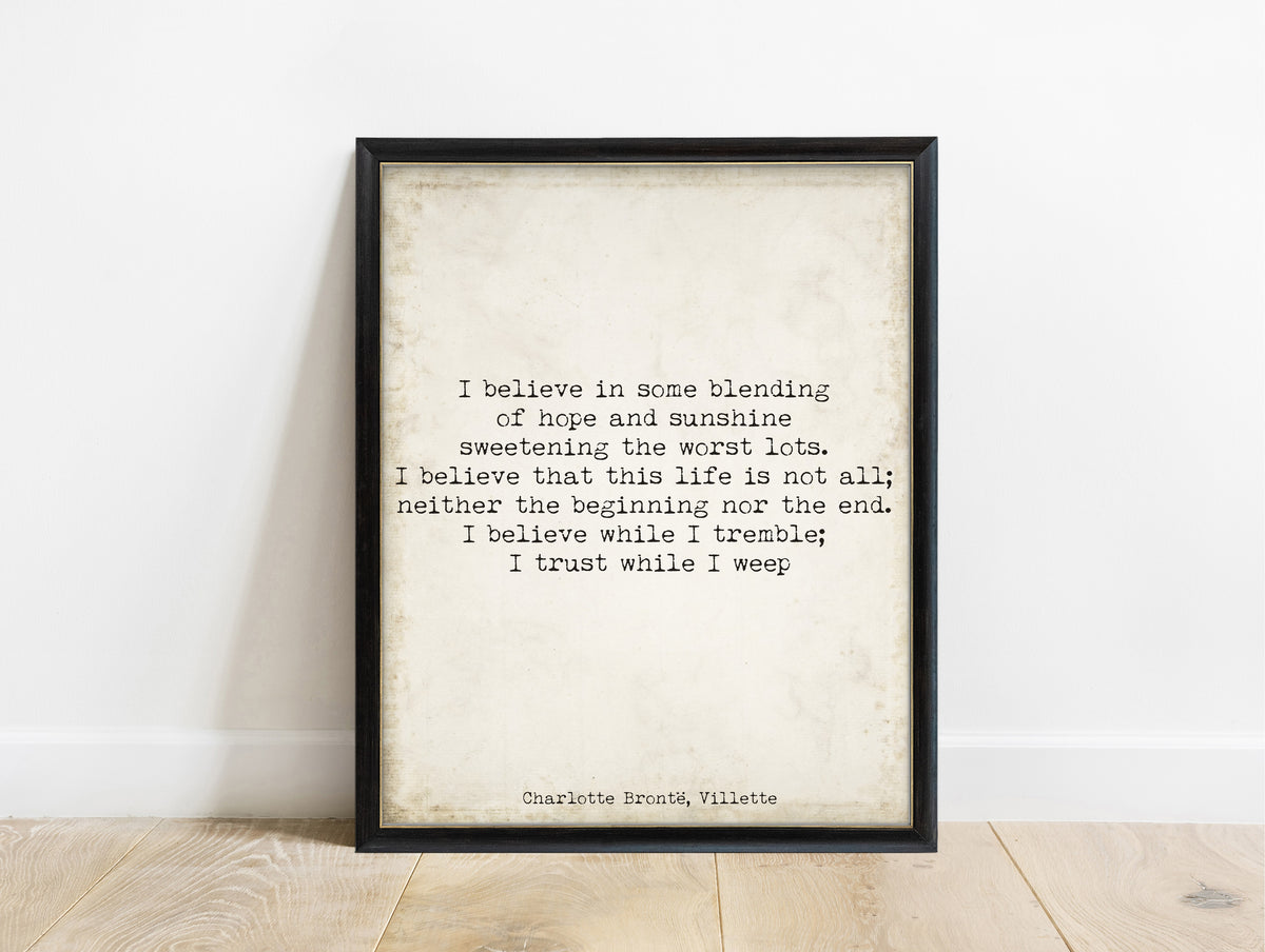 Charlotte Brontë I believe while I tremble quote print in a black frame, vintage background