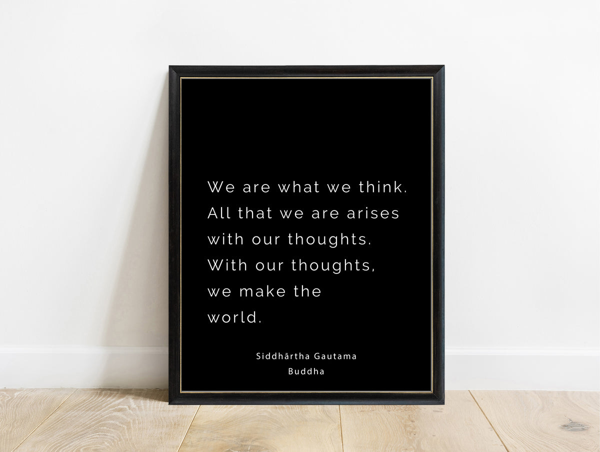 Buddha we are what we think typewriter quote print in a black frame, black background