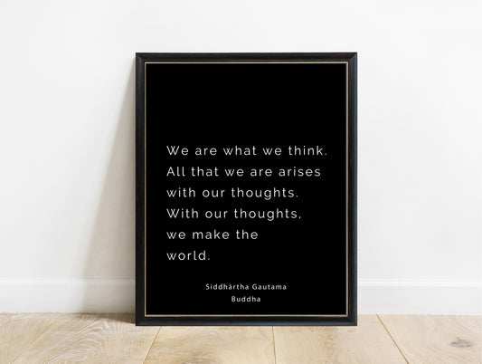 Buddha we are what we think typewriter quote print in a black frame, black background