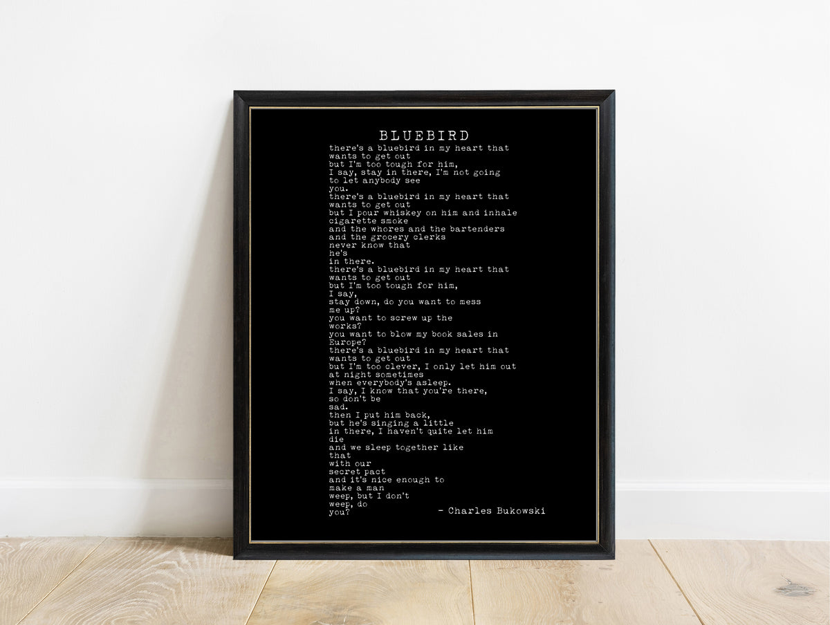 Charles Bukowski Bluebird poem print in typewriter type in a black frame, black background
