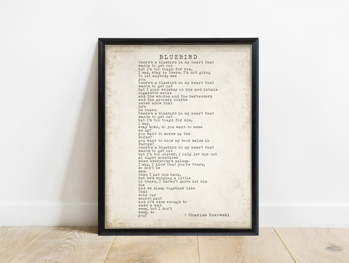 Charles Bukowski Bluebird poem print in typewriter type in a black frame, vintage background