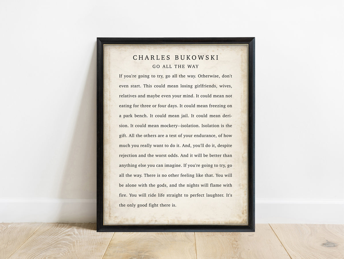 Charles Bukowski Go All the Way quote print in a black frame, vintage background