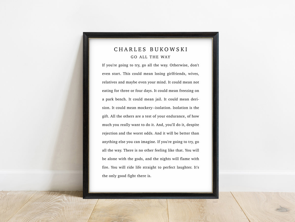 Charles Bukowski Go All the Way quote print in a black frame, white background