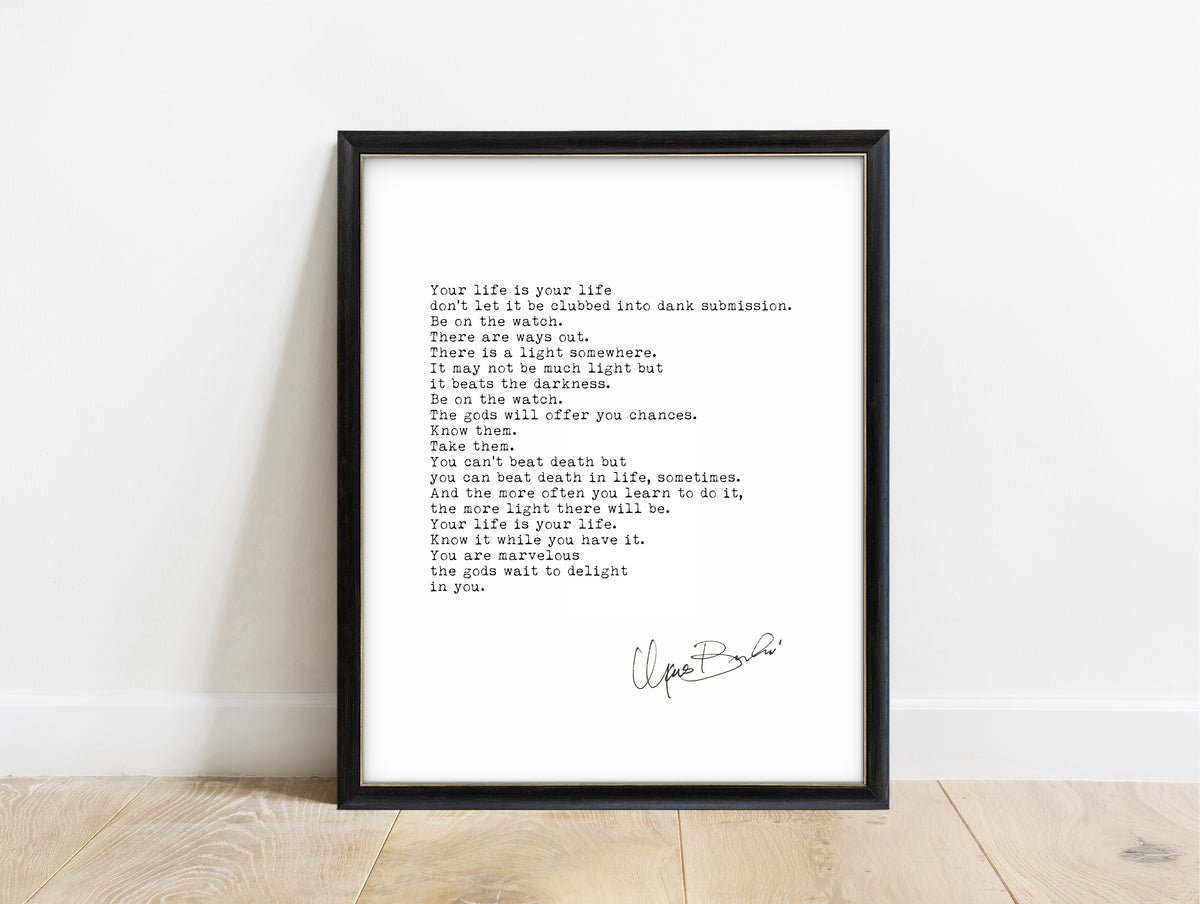 Charles Bukowski The Laughing Heart poem print in a black frame, white background