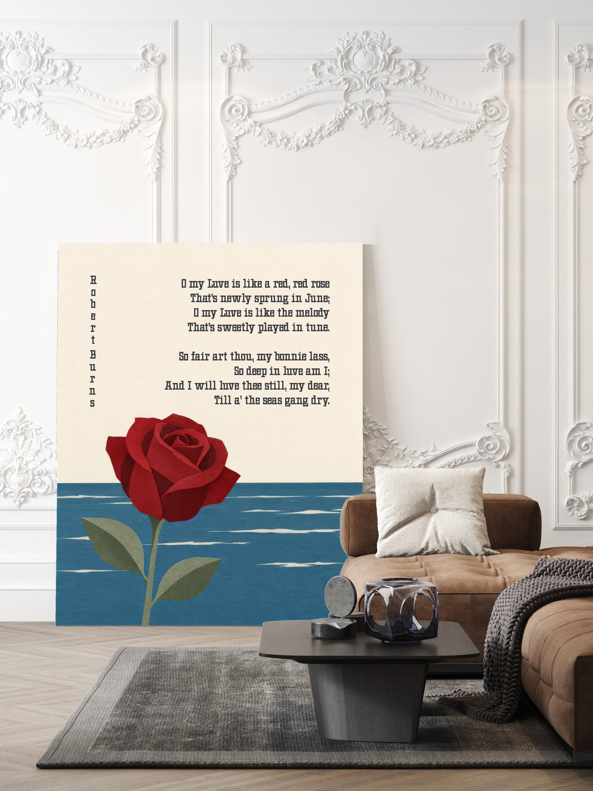 A Red, Red Rose by Robert Burns with a paper cut red rose rising from a blue sea, shown unframed in a living room