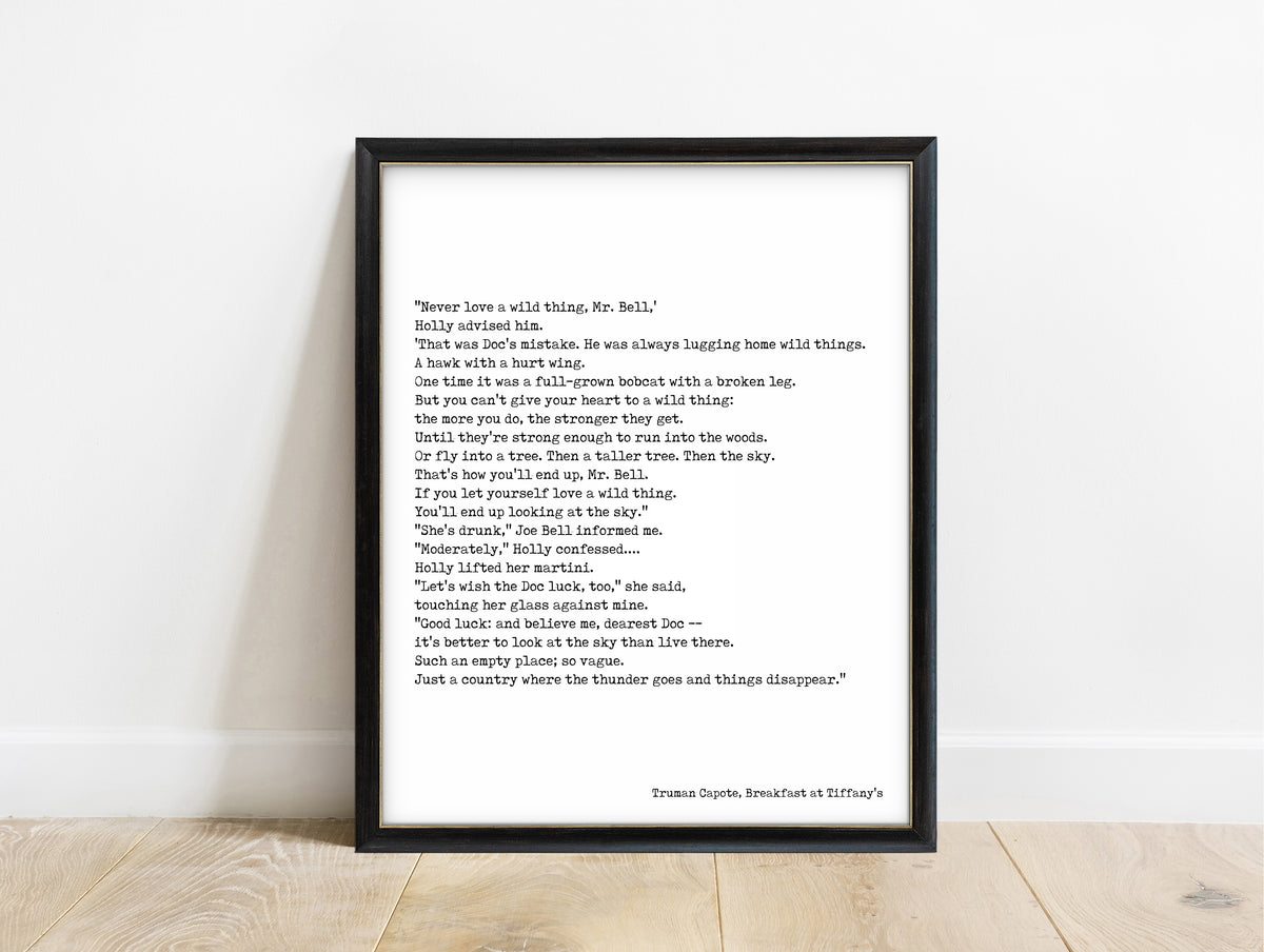Truman Capote never love a wild thing typewriter print in a black frame, white background