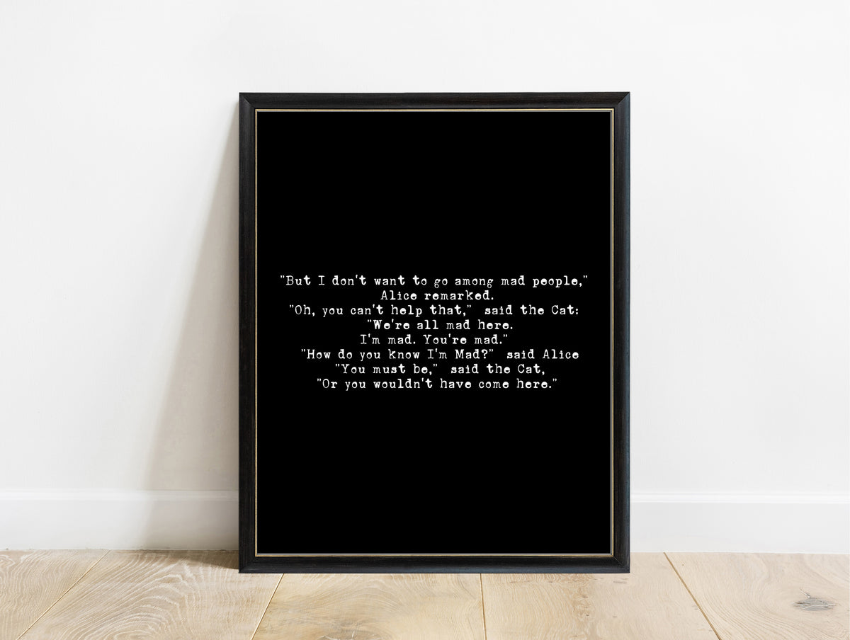 Lewis Carroll we're all mad here bold typewriter quote print in a black frame, black background