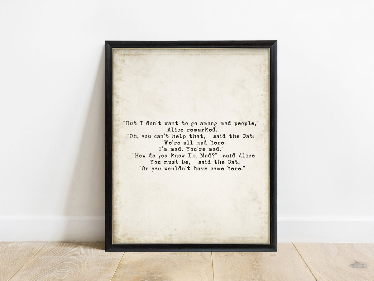 Lewis Carroll we're all mad here bold typewriter quote print in a black frame, vintage background