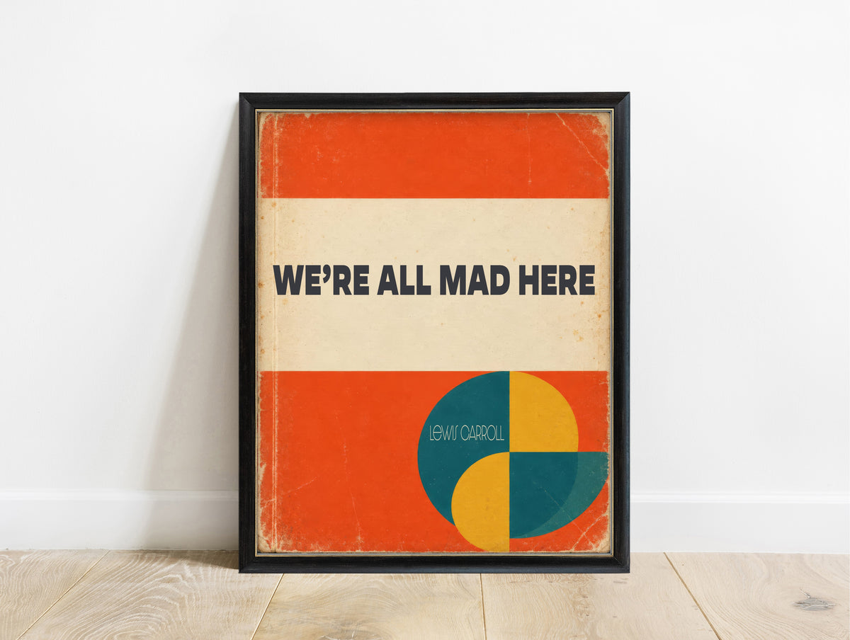 We're all mad here Lewis Carroll quote print in a retro orange book cover design, in a black frame