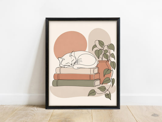 Cat asleep on a stack of books, line art print in a black frame