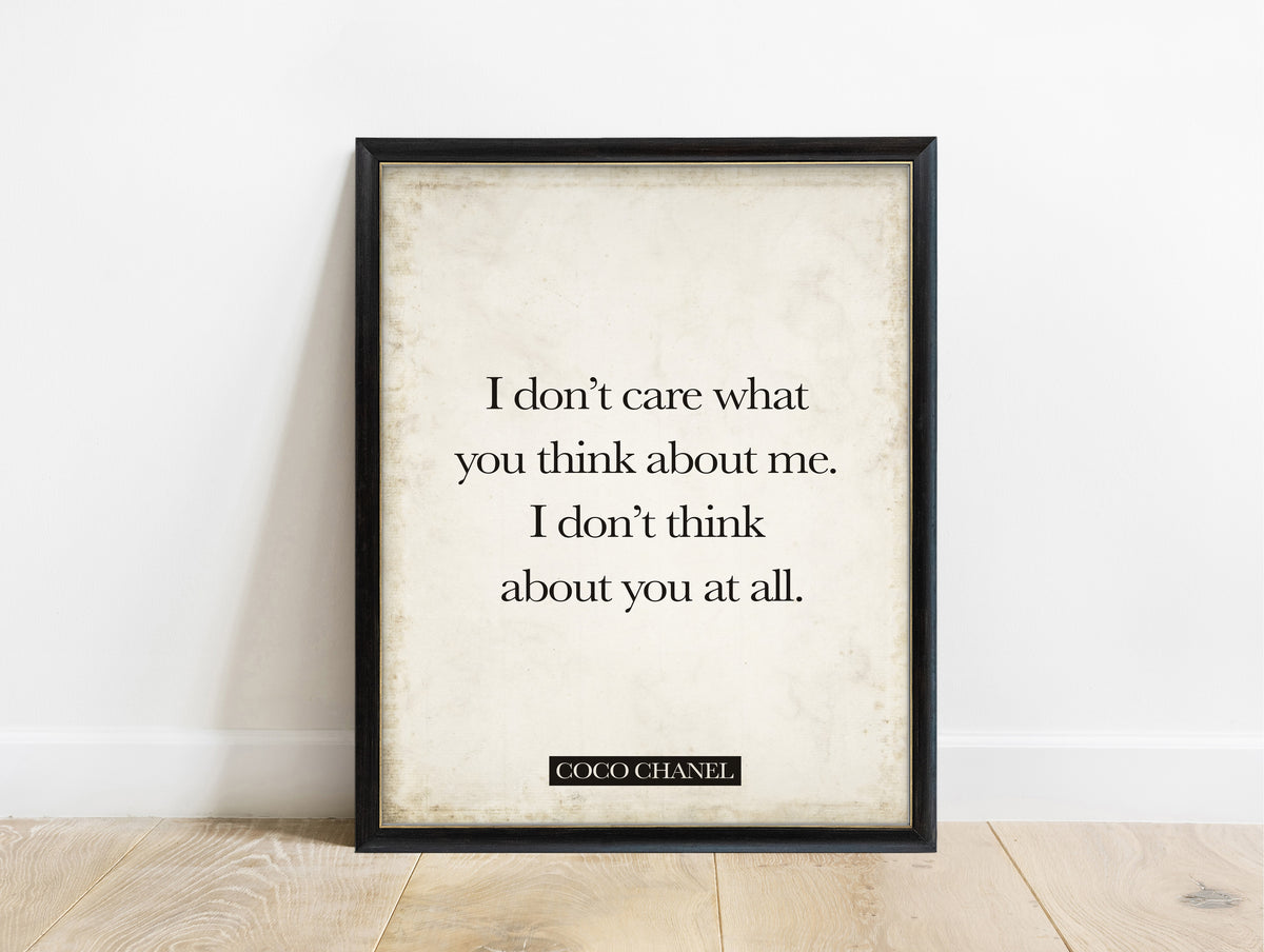 Coco Chanel I don't care what you think quote print in a black frame, vintage background