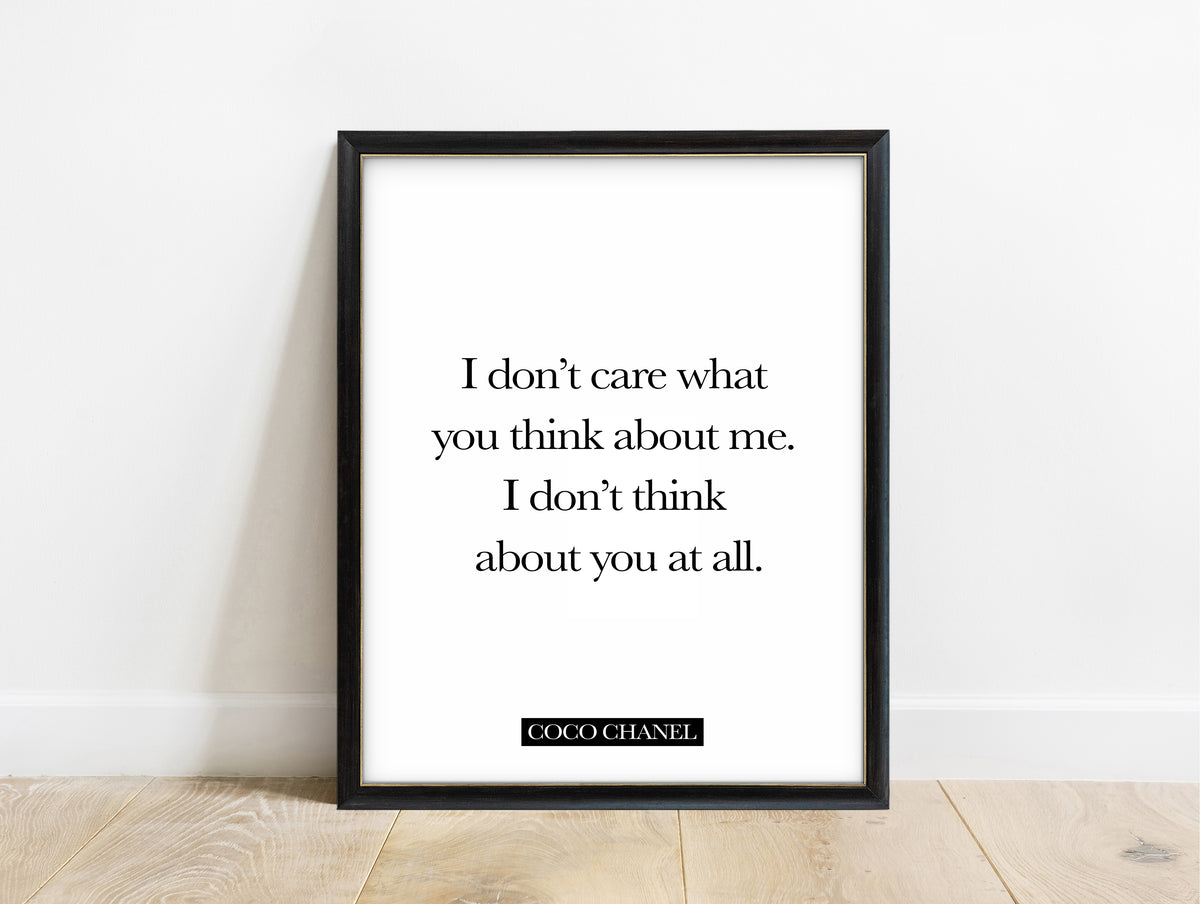 Coco Chanel I don't care what you think quote print in a black frame, white background