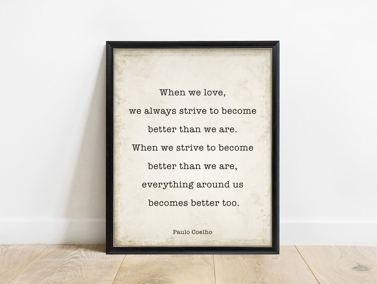 Paulo Coelho when we love quote print in a black frame, vintage background
