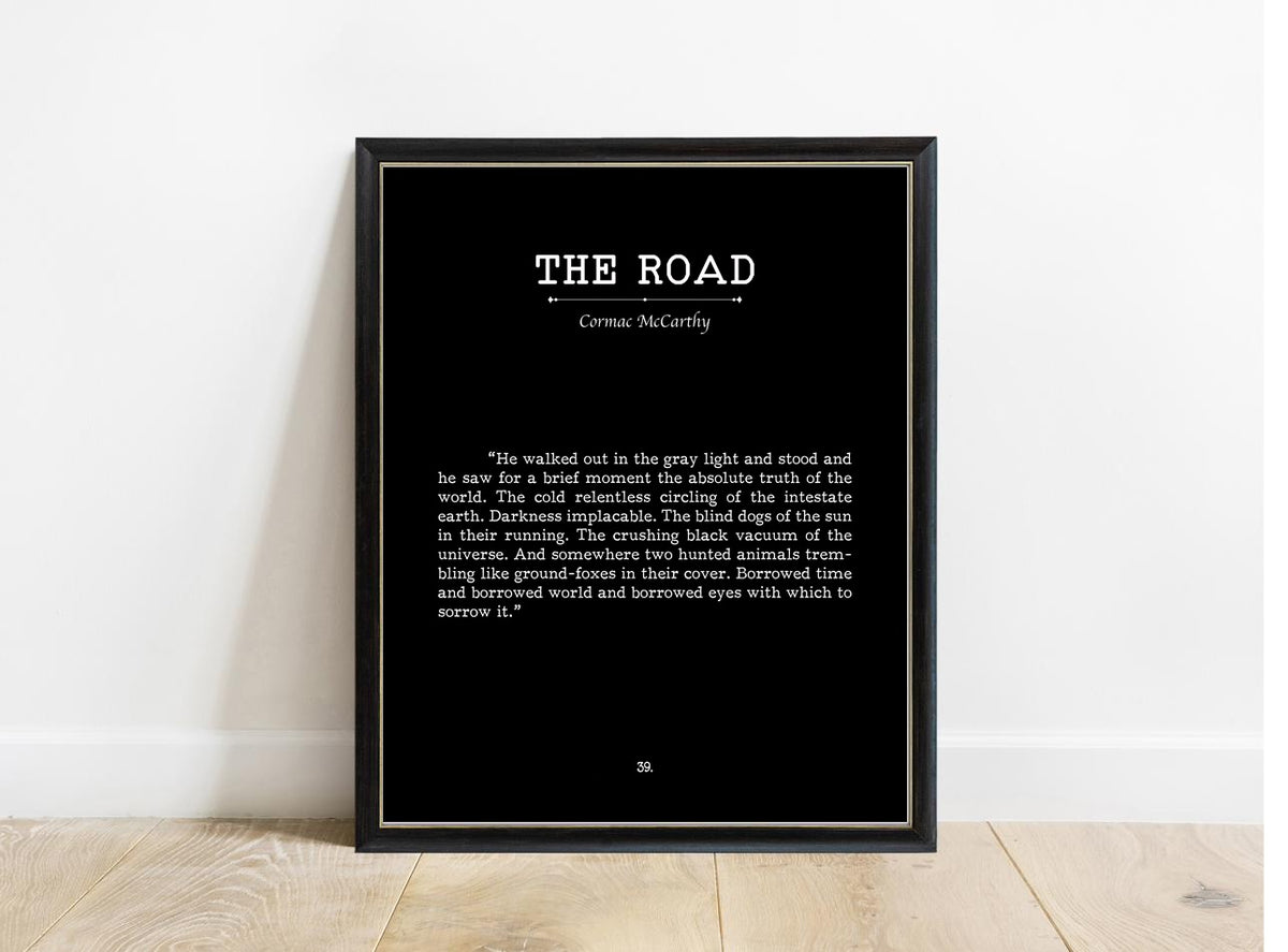 Cormac McCarthy The Road book page print in a black frame, black background