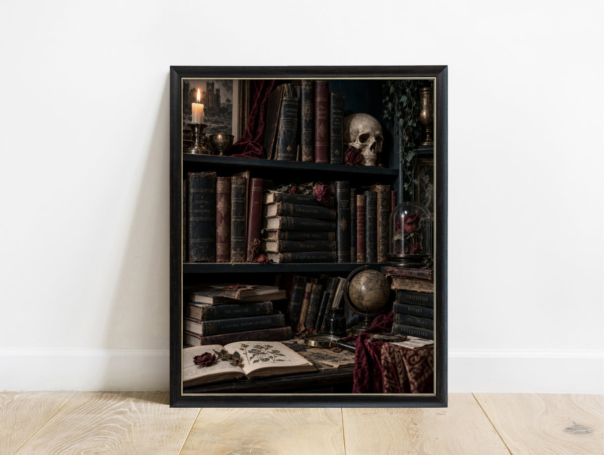 Dark academia bookshelf with antique books, a skull with a dried rose, candle and rose under a glass dome in a black frame