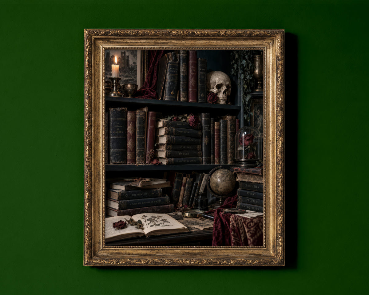 Dark academia bookshelf with antique books, a skull with a dried rose, candle and rose under a glass dome shown in a gold frame for display only; framed prints are sent in a black frame