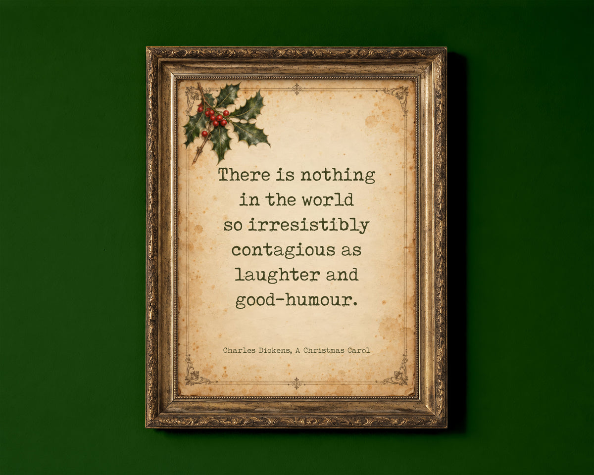There is nothing in the world so irresistibly contagious as laughter and good-humour, Charles Dickens A Christmas Carol quote on antique paper with holly shown in a gold frame for display only; framed prints are sent in a black frame