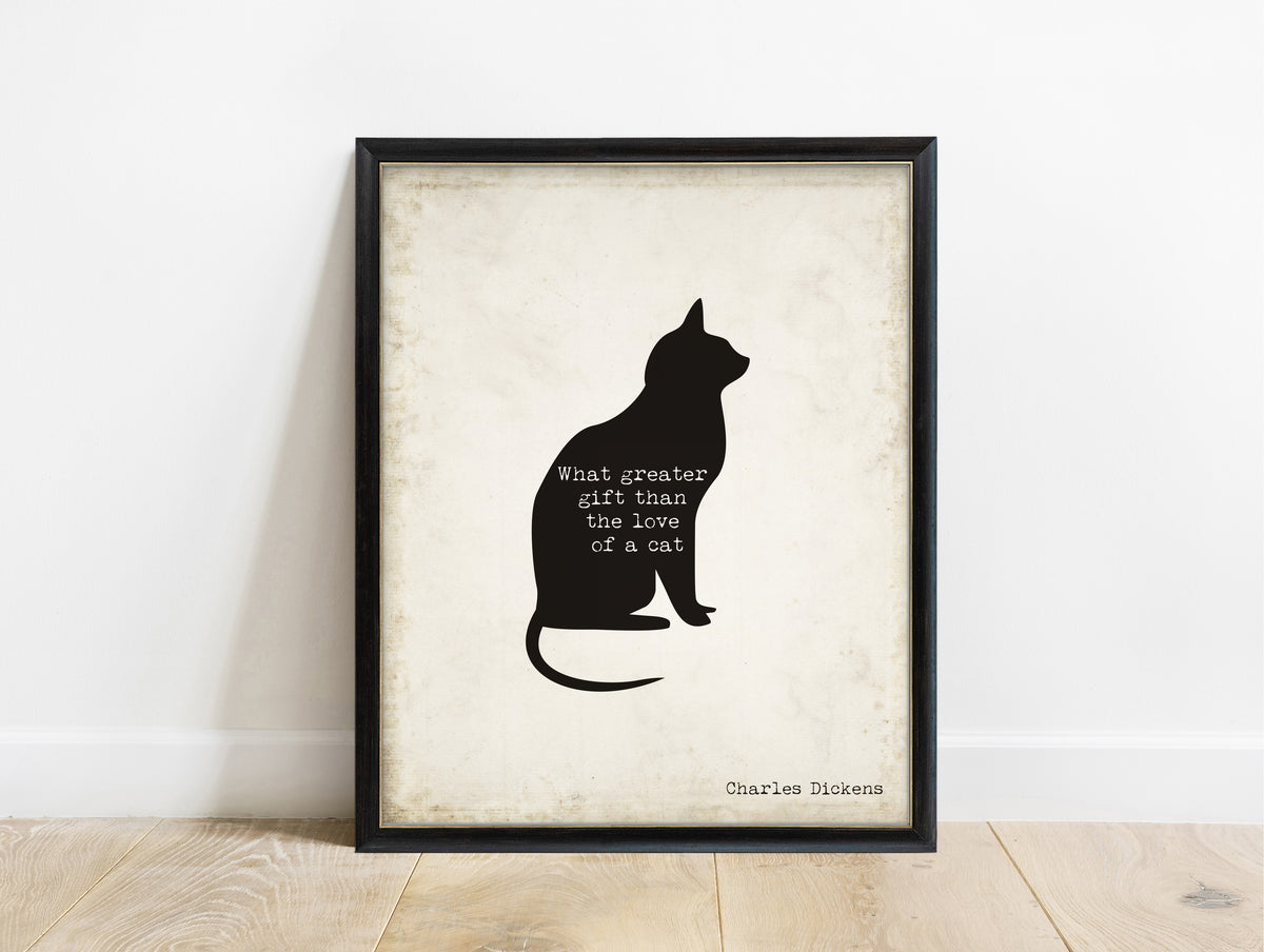 Charles Dickens love of a cat quote with a cat silhouette print in a black frame, vintage background