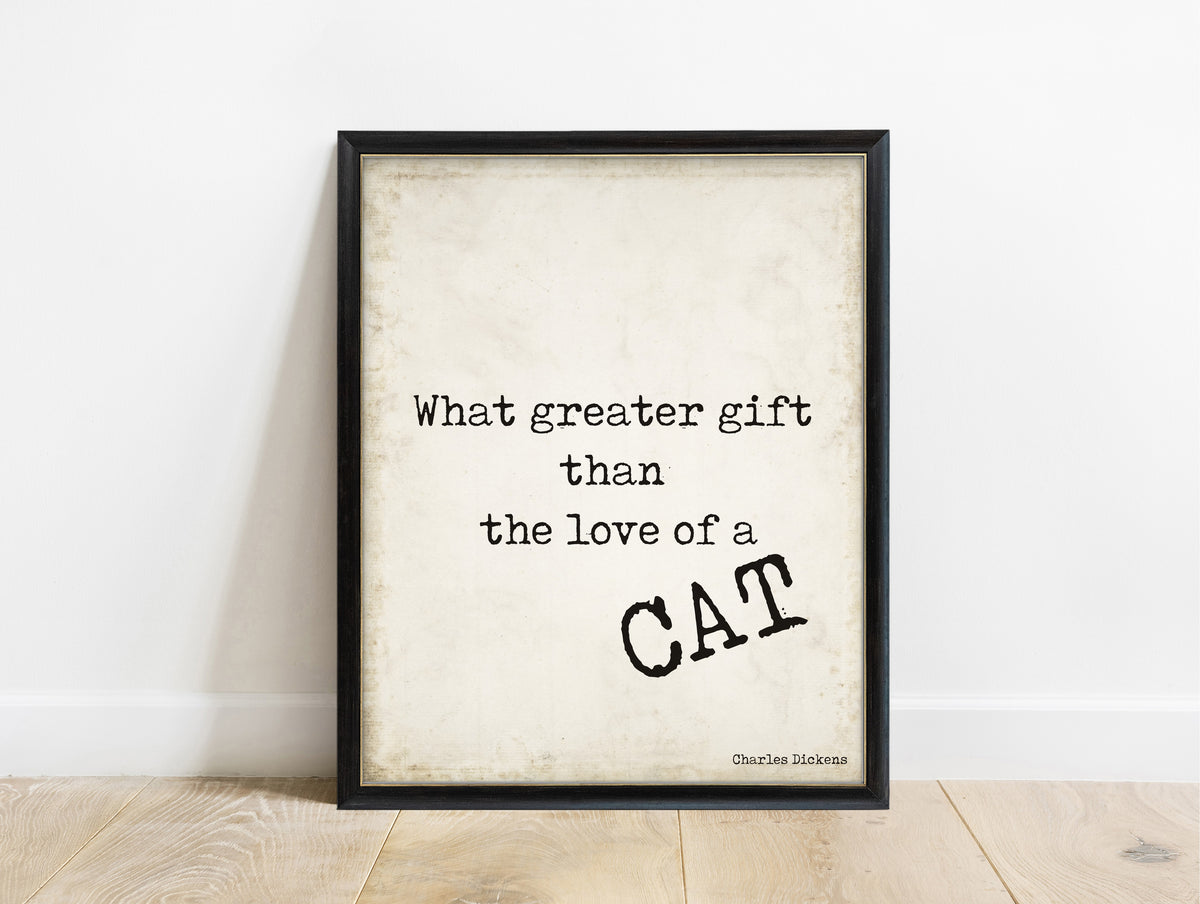 Charles Dickens love of a cat quote print in a black frame, vintage background
