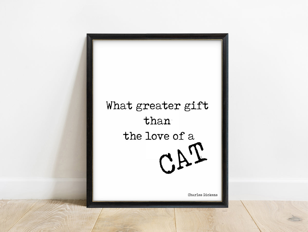 Charles Dickens love of a cat quote print in a black frame, white background