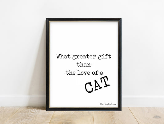 Charles Dickens love of a cat quote print in a black frame, white background