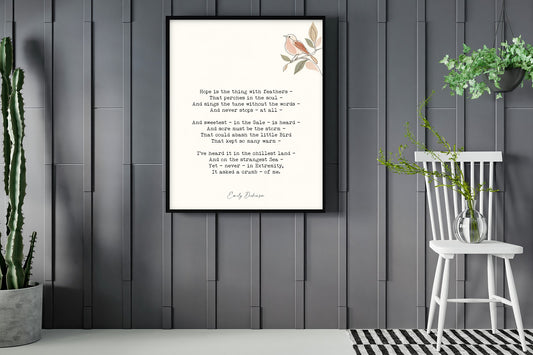 Emily Dickinson hope is the thing with feathers poem with bird illustration print framed in a room with plants