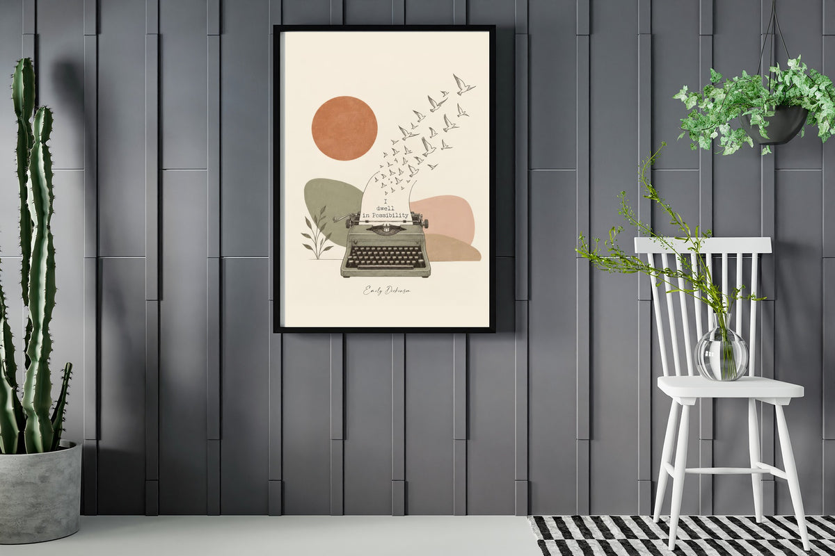 Emily Dickinson I dwell in Possibility quote with a vintage typewriter and birds illustration print framed in a room with plants
