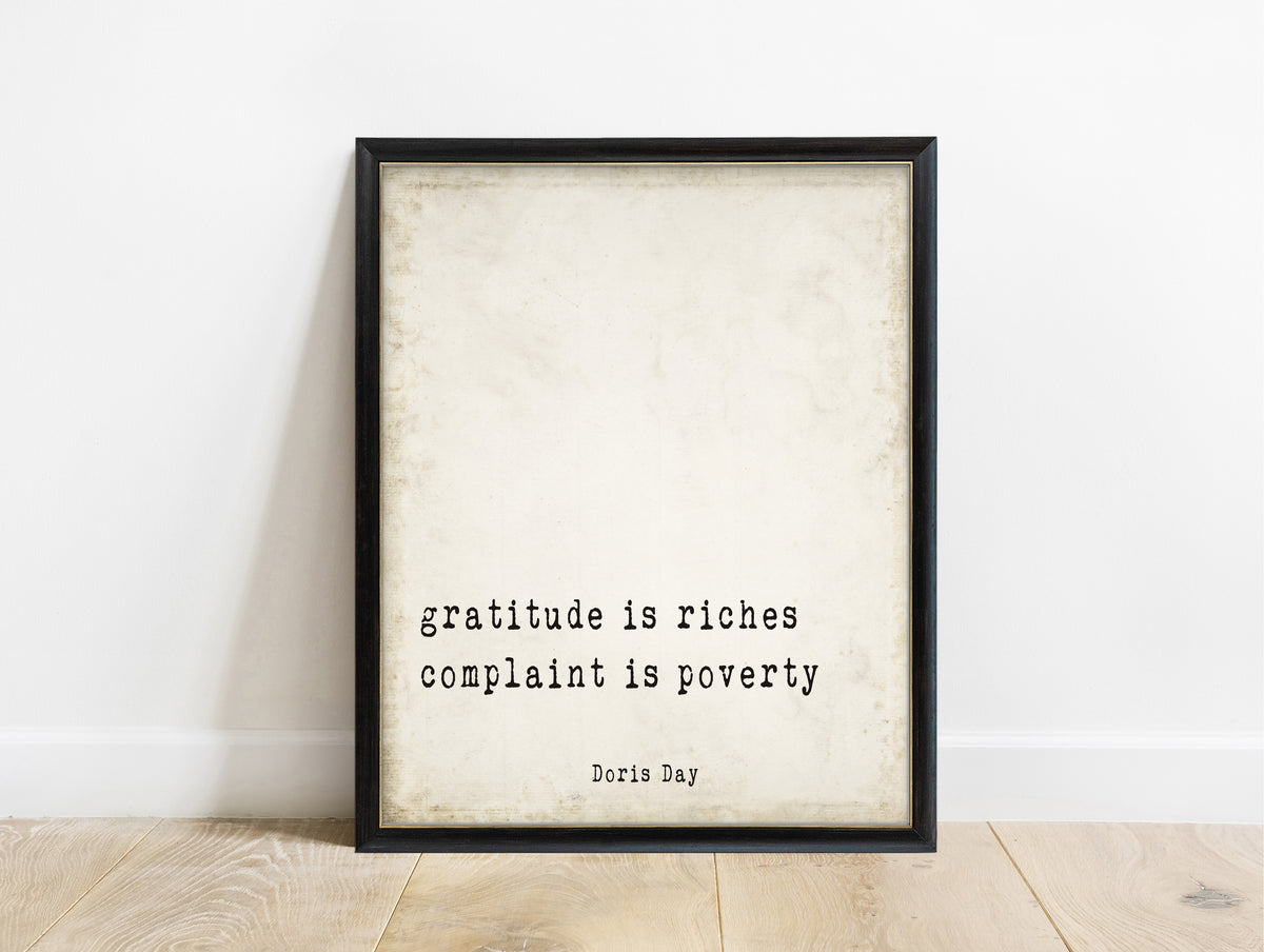 Doris Day gratitude is riches quote print in a black frame, vintage background