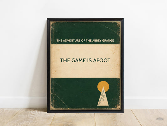 The game is afoot Sherlock Holmes quote by Arthur Conan Doyle in a retro green book cover design, in a black frame