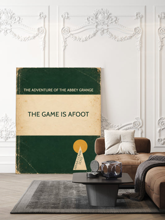 The game is afoot Sherlock Holmes quote by Arthur Conan Doyle in a retro green book cover design, shown unframed in a living room