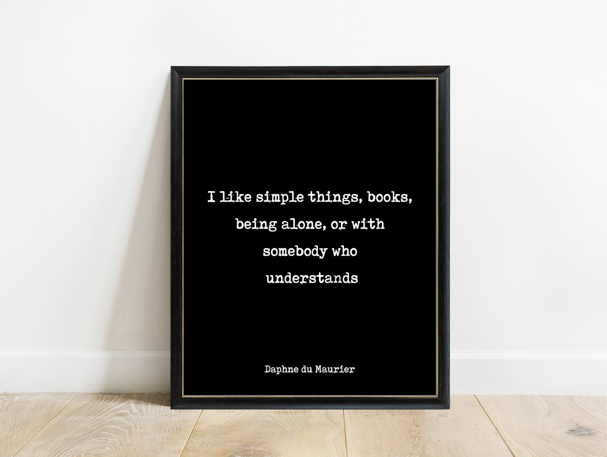Daphne du Maurier I like simple things books being alone typewriter quote print in a black frame, black background