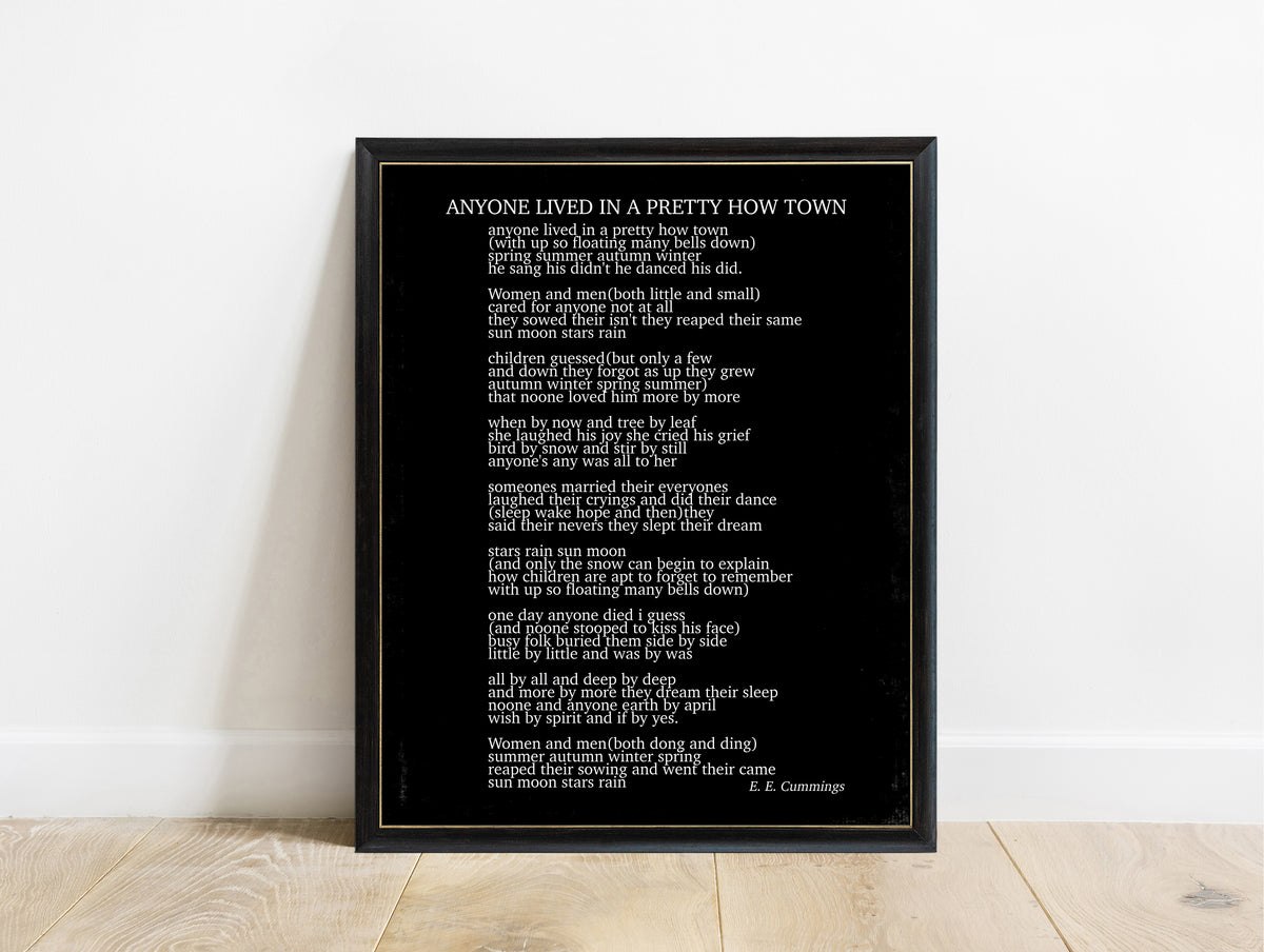 EE Cummings anyone lived in a pretty how town poem print in a black frame, black background