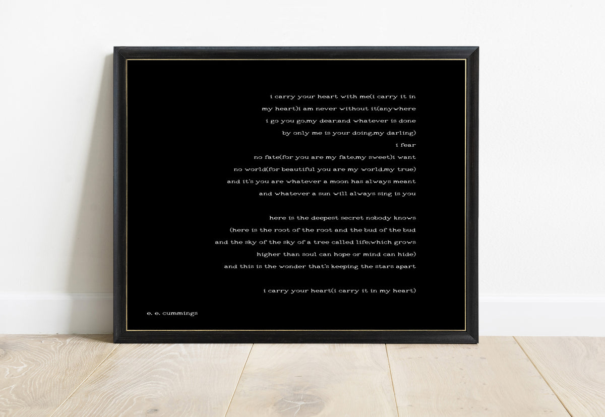 EE Cummings i carry your heart landscape right justified print in a black frame, black background