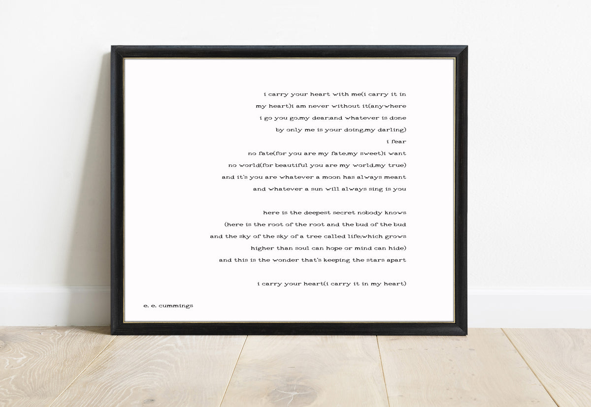 EE Cummings i carry your heart landscape right justified print in a black frame, white background