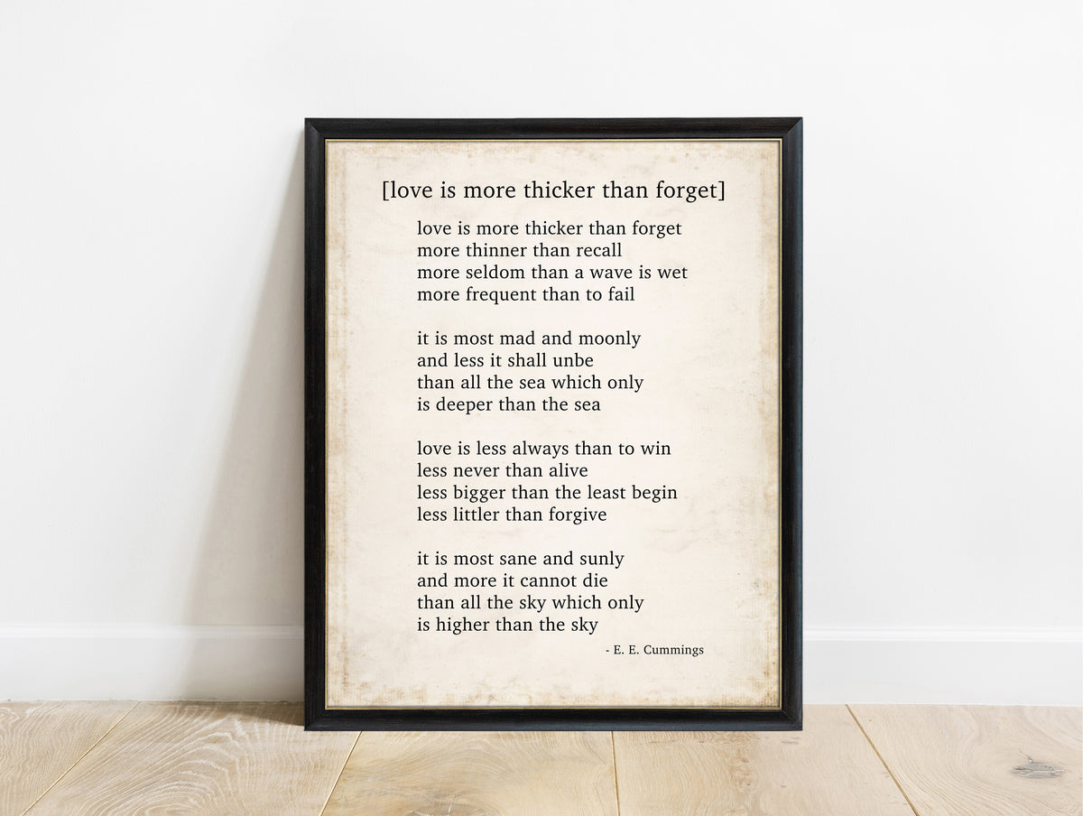 EE Cummings Love Is More Thicker Than Forget poem print in a black frame, vintage background