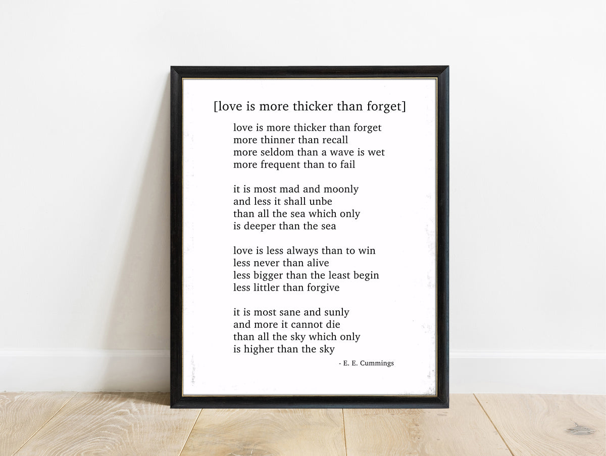 EE Cummings Love Is More Thicker Than Forget poem print in a black frame, white background