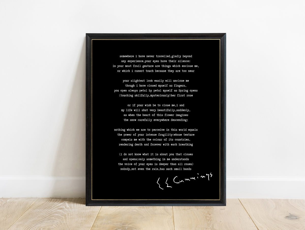 EE Cummings Somewhere I Have Never Travelled poem print in a black frame, black background