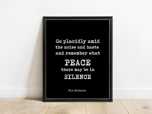 Max Ehrmann Desiderata go placidly peace and silence quote print in a black frame, black background